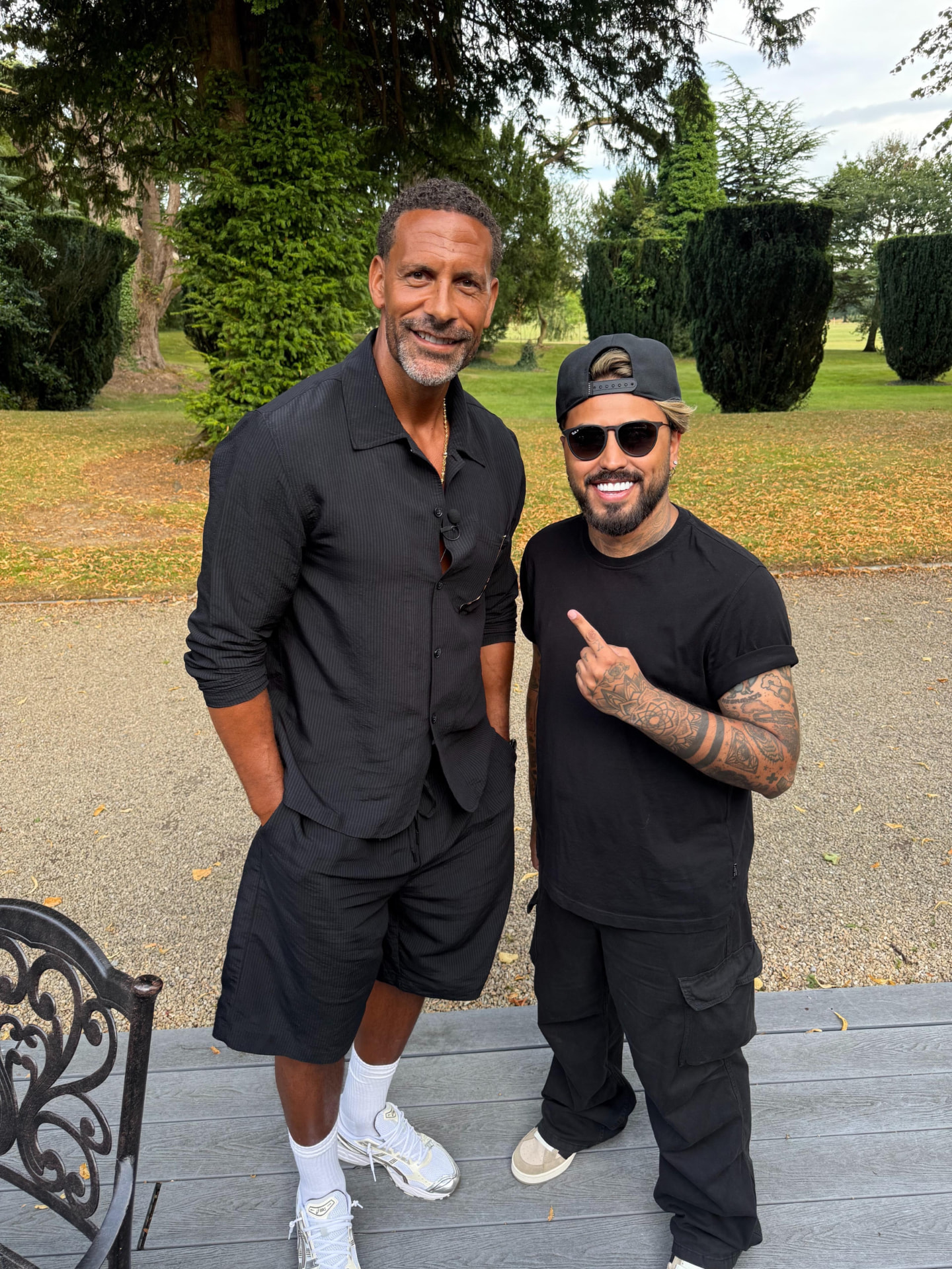 Gerryn Hussain standing with Rio Ferdinand